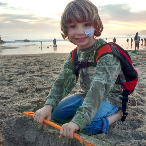 Gage with his VAD on the beach.